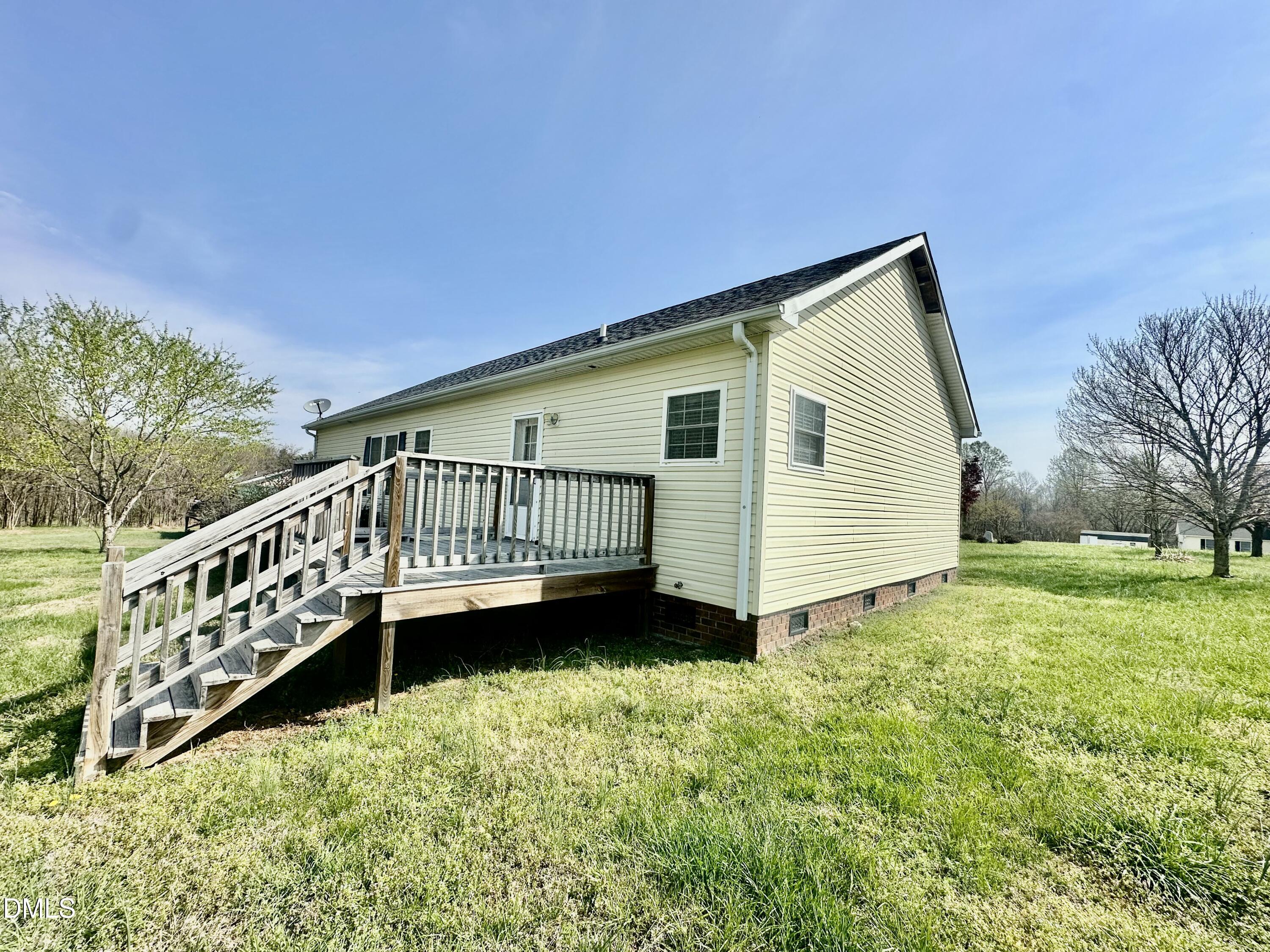 155 Collin Drive Roxboro, NC 27574 - Photo 16 of 20 a view of a house with a yard from a balcony