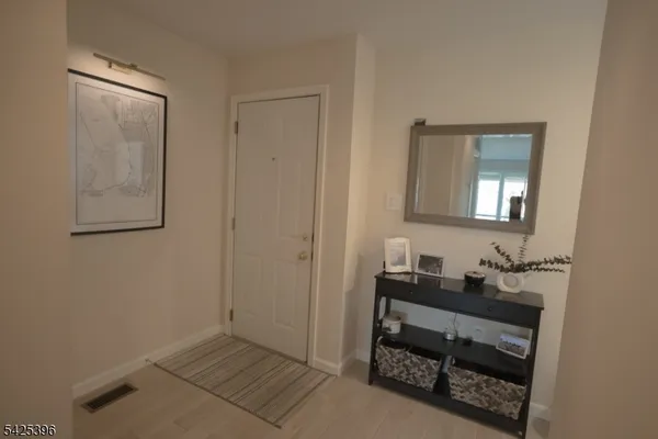 a room that has a mirror and a sink in it
