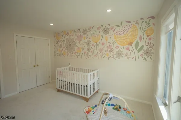 a bedroom with a baby crib