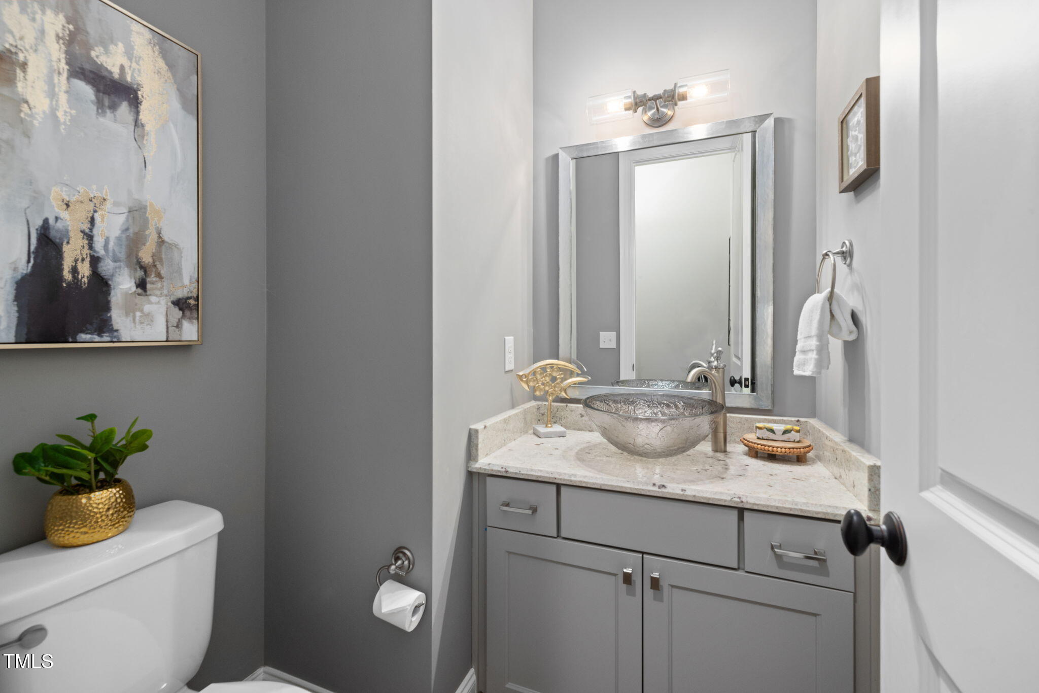 170 Pine Cone Loop Pittsboro, NC 27312 - Photo 14 of 58 a bathroom with a granite countertop sink a toilet and a mirror