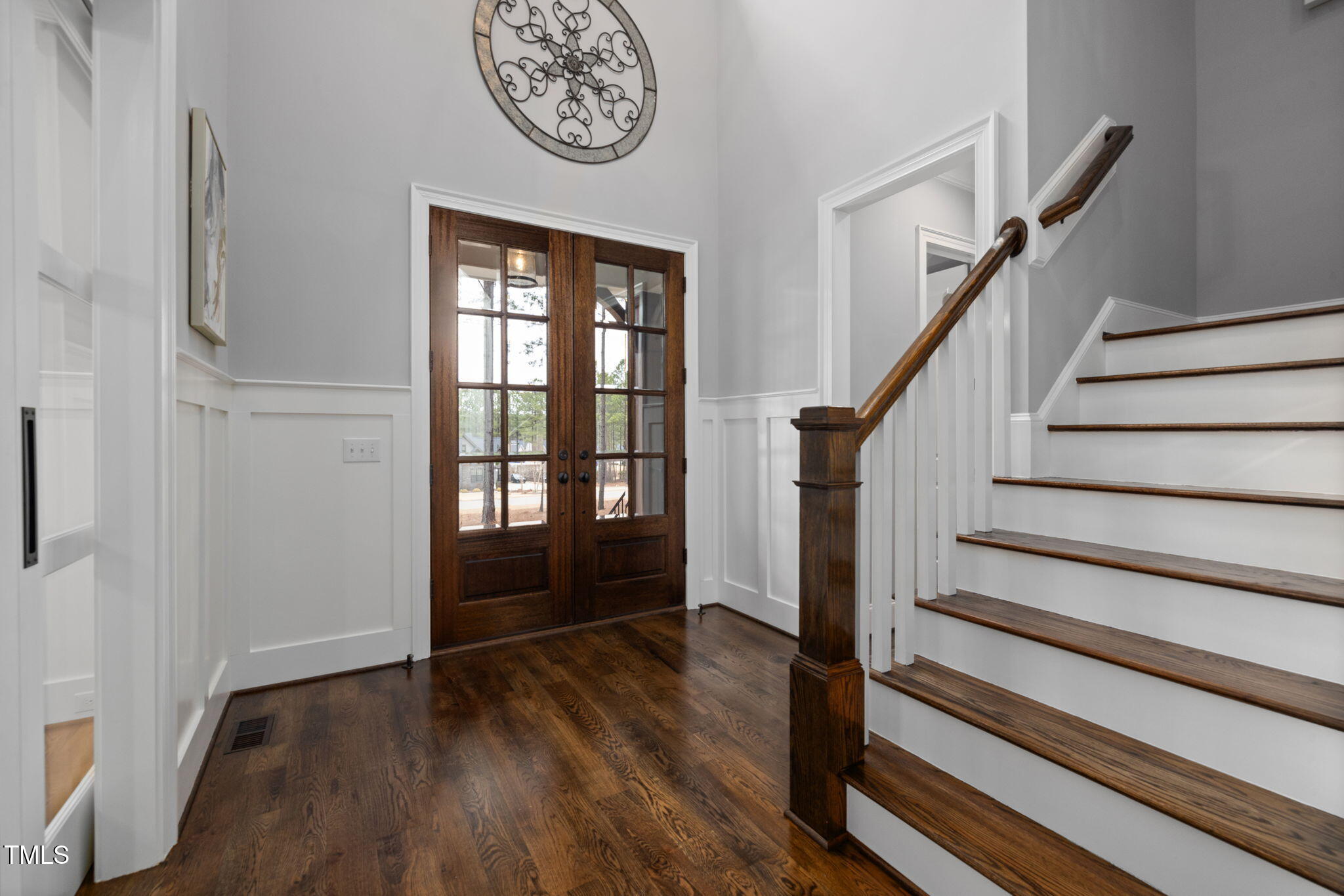 170 Pine Cone Loop Pittsboro, NC 27312 - Photo 16 of 58 a view of a hallway with wooden floor and a window