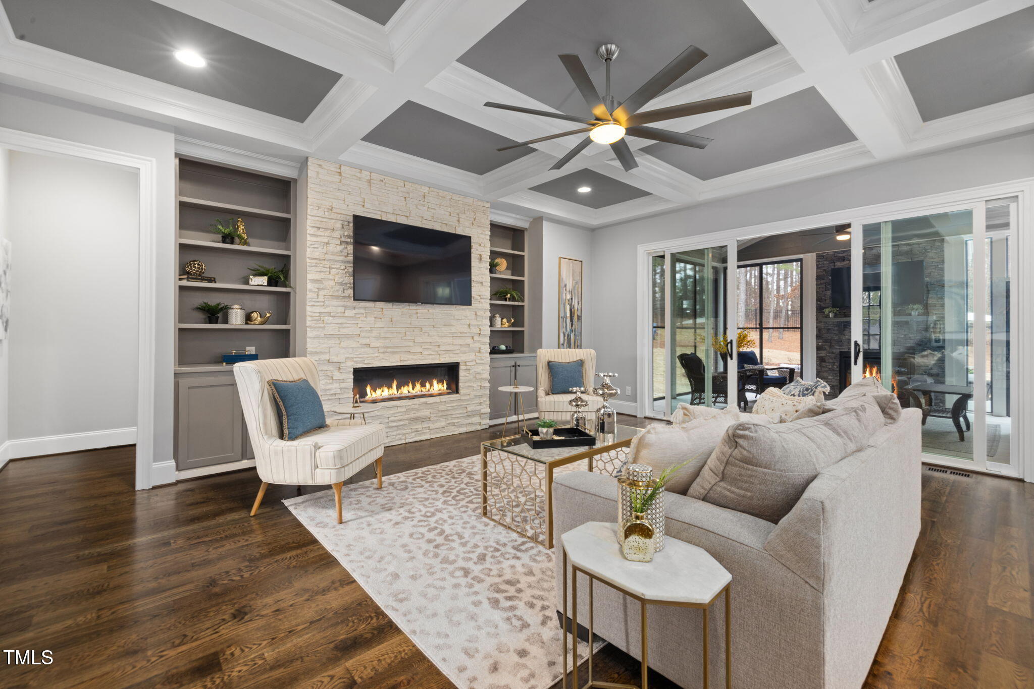 170 Pine Cone Loop Pittsboro, NC 27312 - Photo 18 of 58 a living room with furniture a fireplace and a flat screen tv