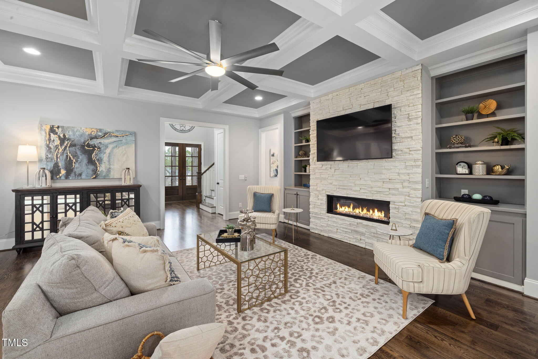 170 Pine Cone Loop Pittsboro, NC 27312 - Photo 19 of 58 a living room with furniture a flat screen tv and a fireplace