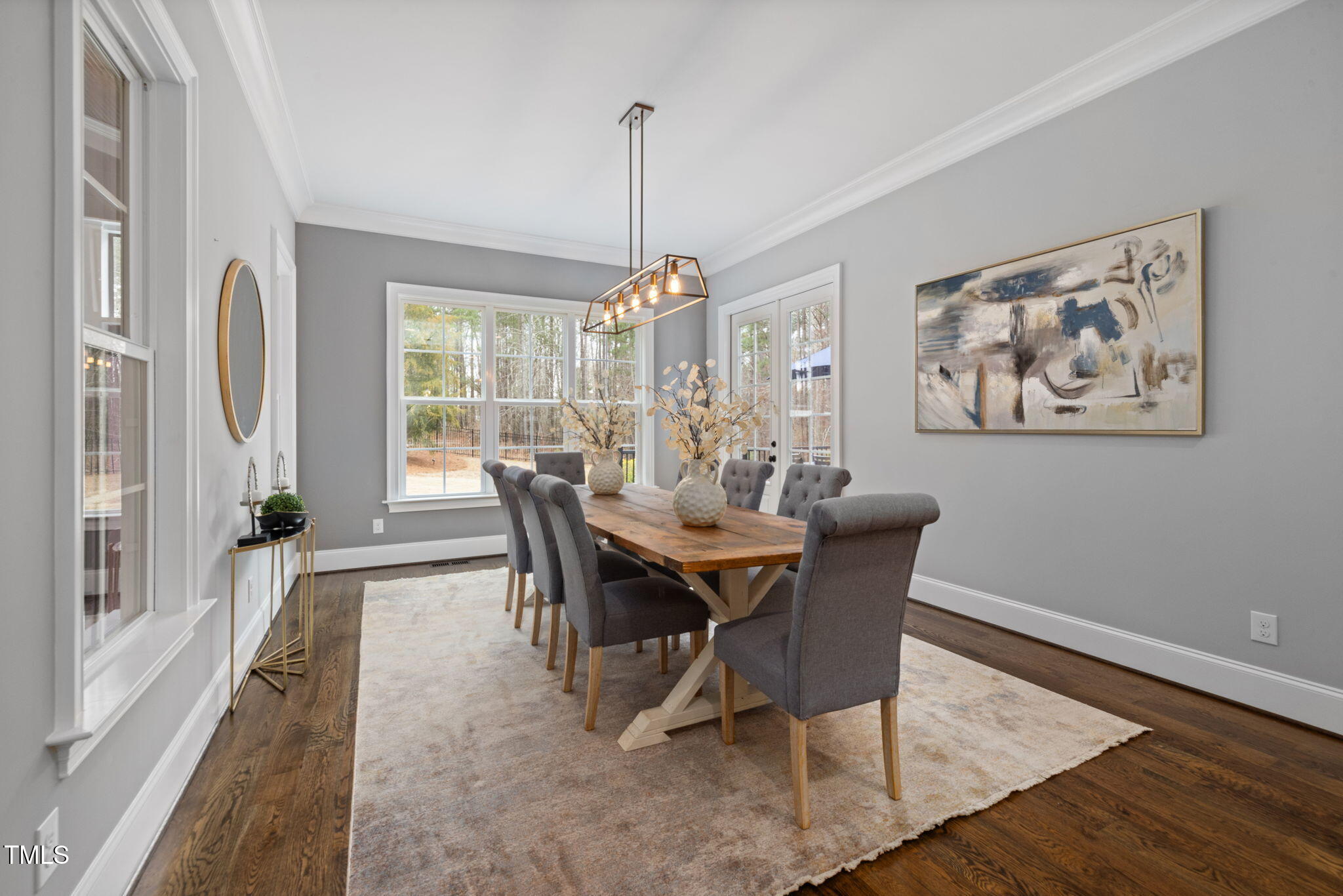 170 Pine Cone Loop Pittsboro, NC 27312 - Photo 21 of 58 a view of a dining room with furniture window and wooden floor