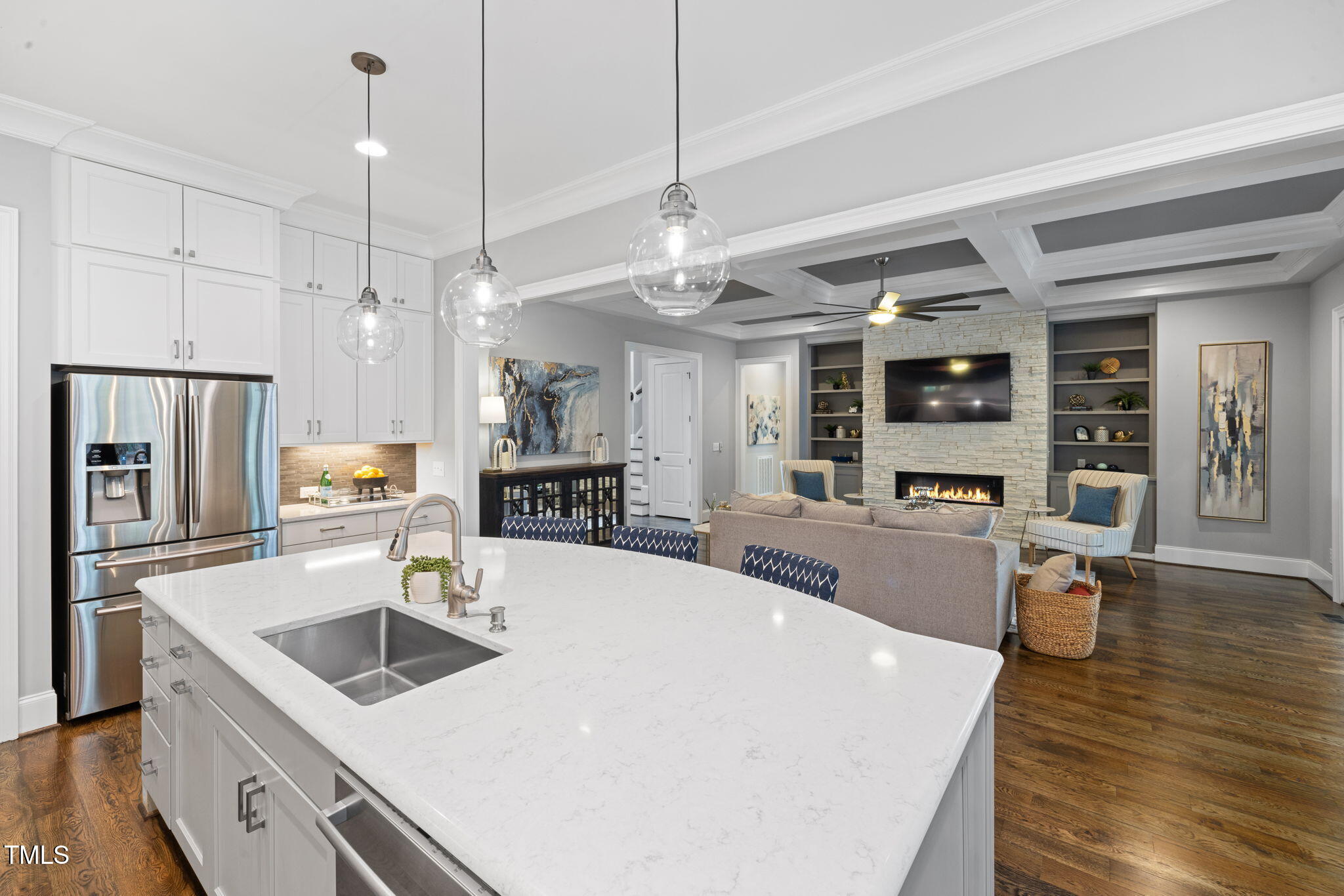 170 Pine Cone Loop Pittsboro, NC 27312 - Photo 25 of 58 a large kitchen with kitchen island a stove a sink a dining table and chairs