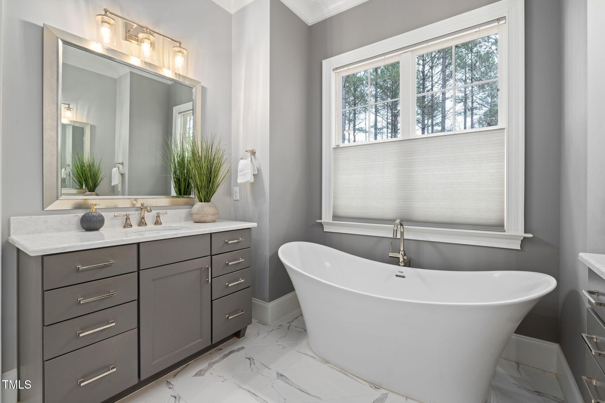 170 Pine Cone Loop Pittsboro, NC 27312 - Photo 29 of 58 a spacious bathroom with a tub sink and mirror