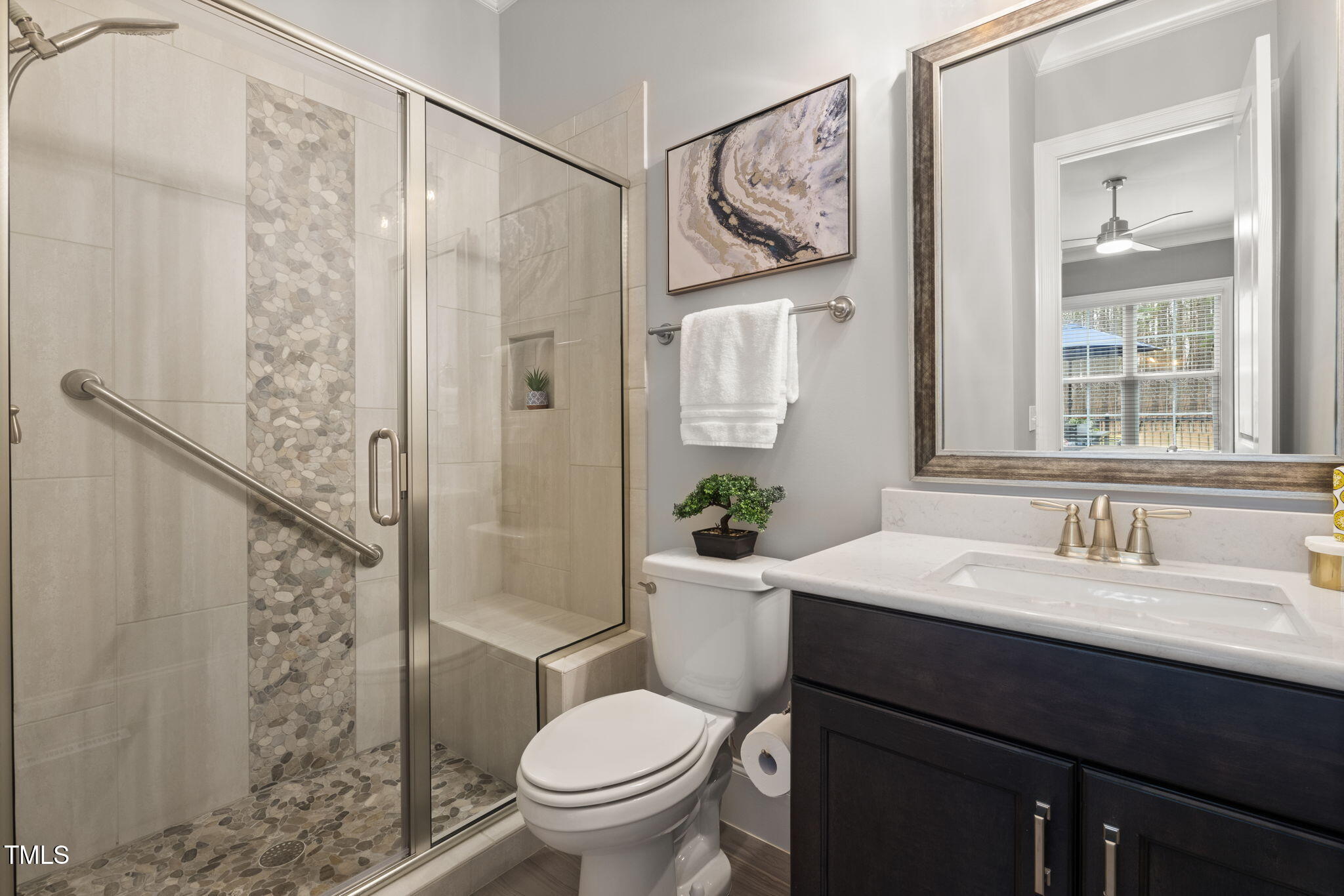 170 Pine Cone Loop Pittsboro, NC 27312 - Photo 36 of 58 a bathroom with a sink toilet and shower