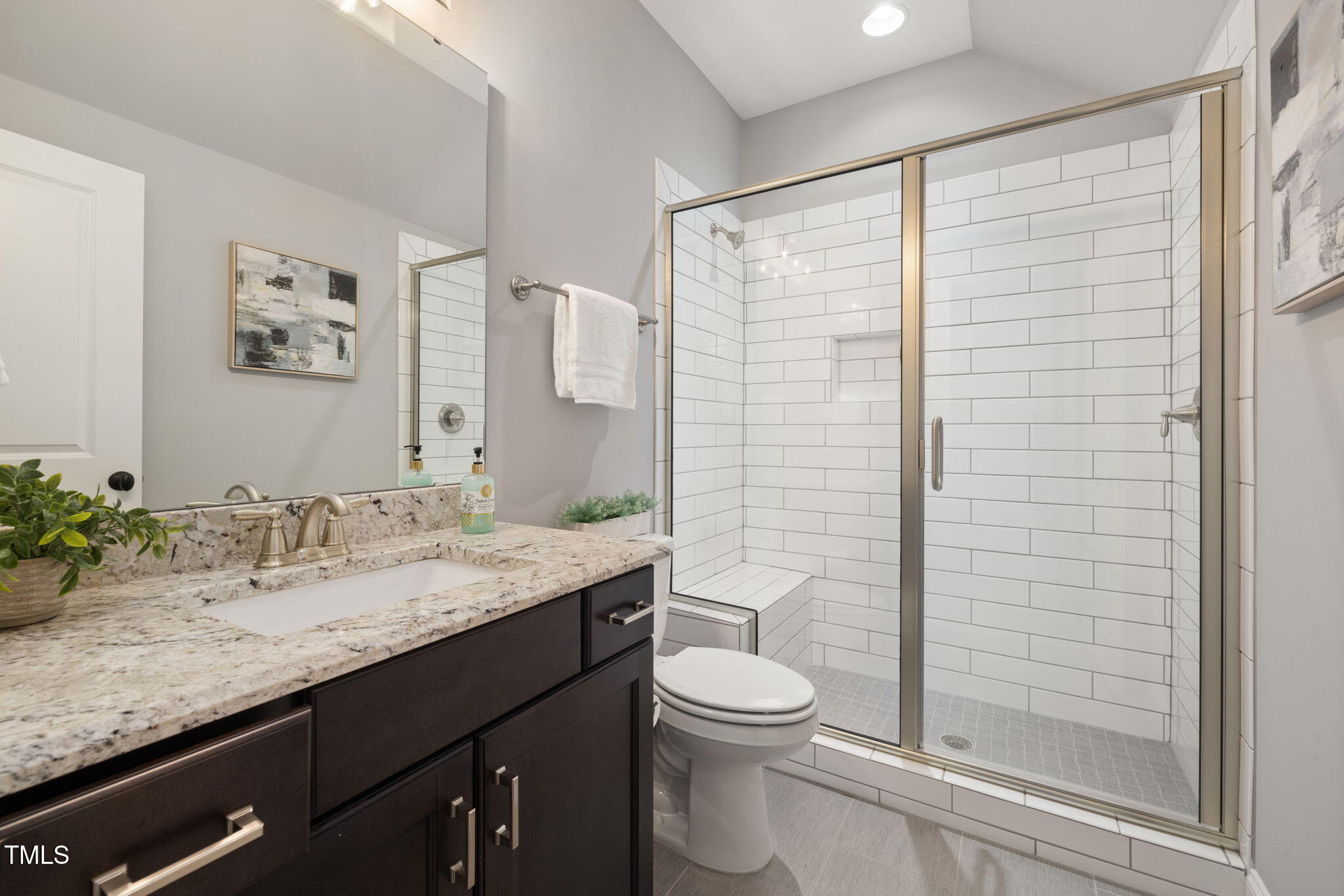 170 Pine Cone Loop Pittsboro, NC 27312 - Photo 39 of 58 a bathroom with a granite countertop sink toilet and shower
