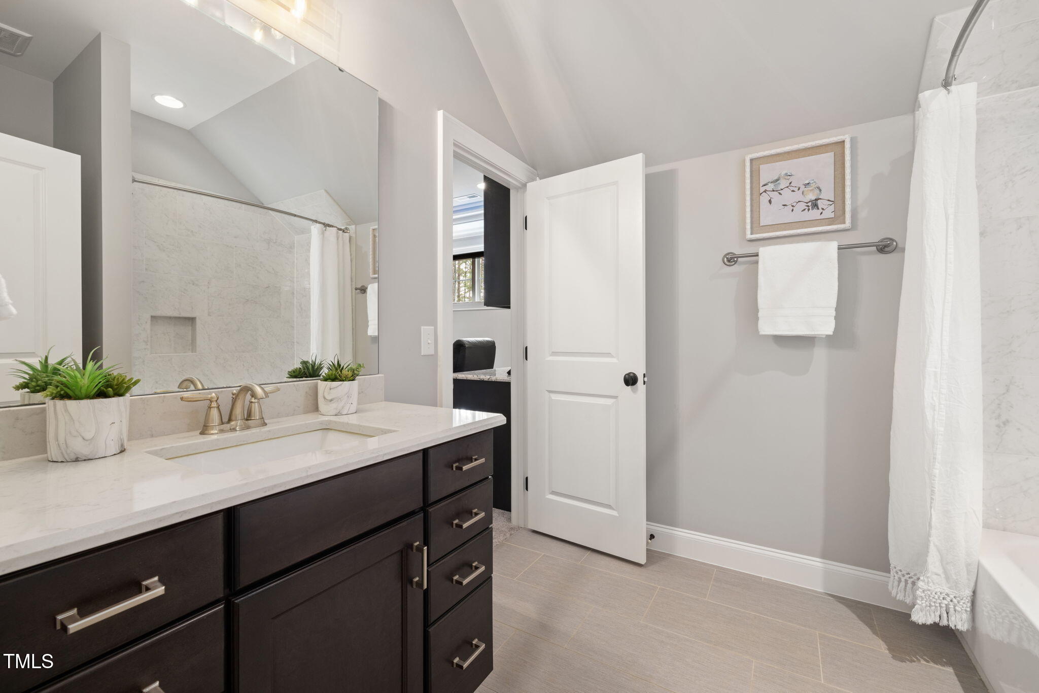 170 Pine Cone Loop Pittsboro, NC 27312 - Photo 44 of 58 a bathroom with a granite countertop sink a mirror a vanity and shower