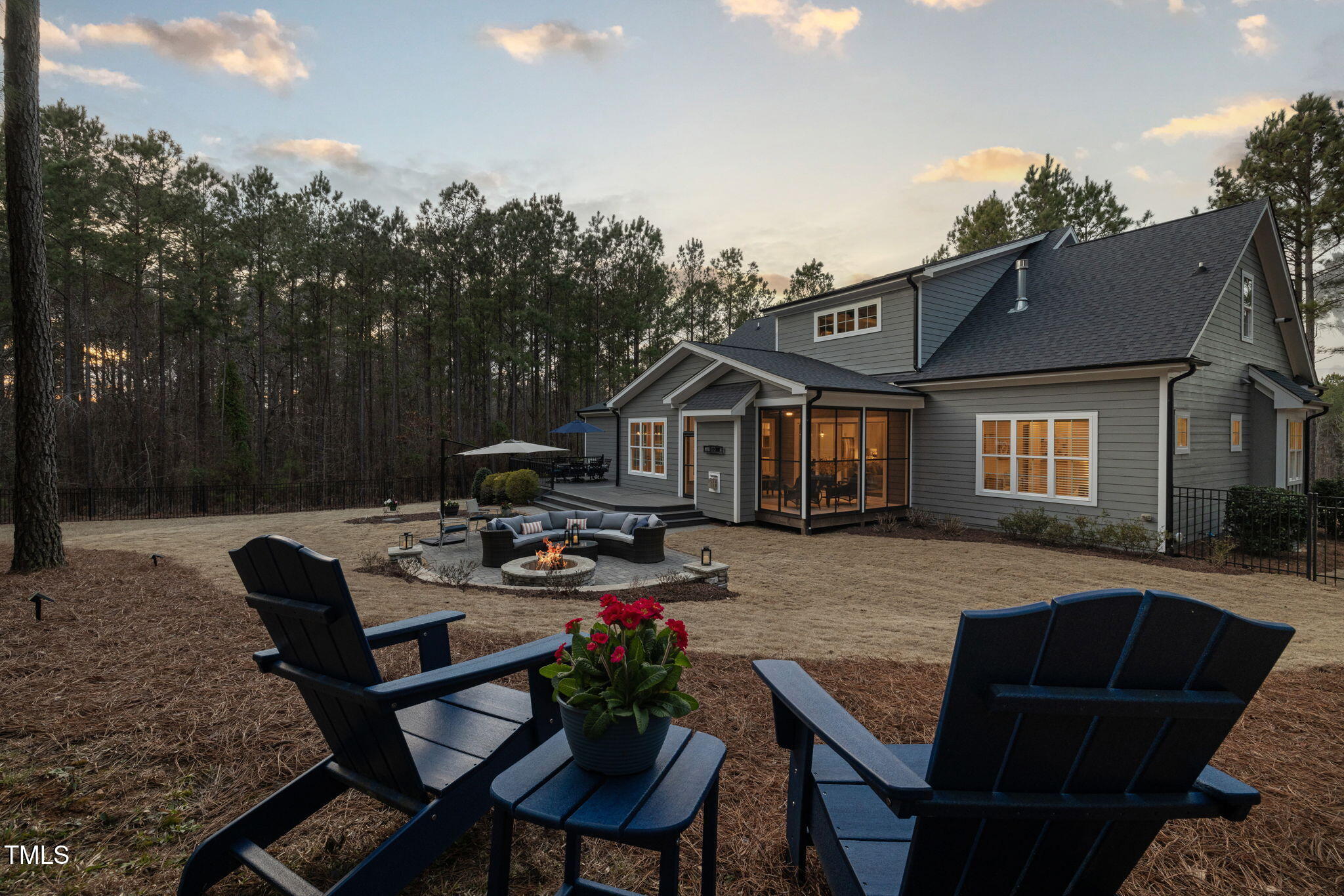170 Pine Cone Loop Pittsboro, NC 27312 - Photo 58 of 58 a view of a patio with couches chairs and a fire pit