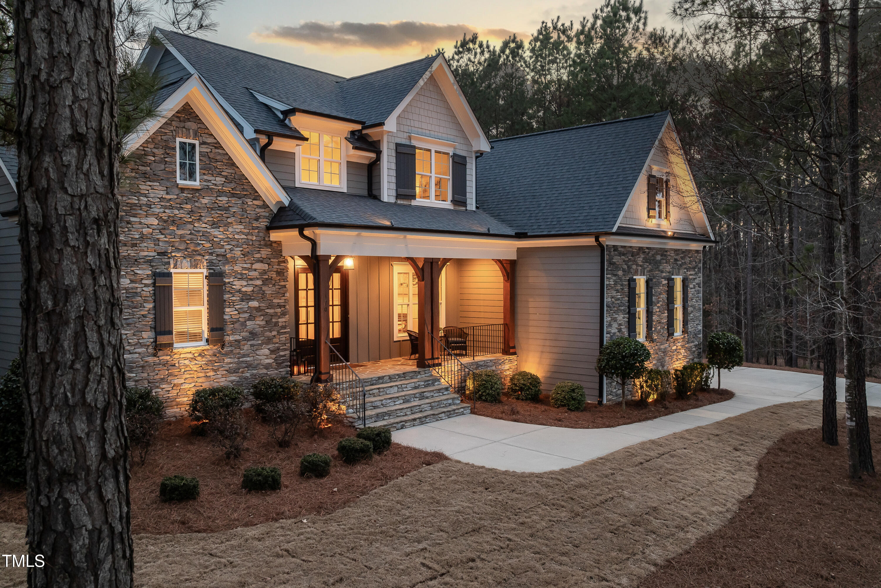 170 Pine Cone Loop Pittsboro, NC 27312 - Photo 6 of 58 a front view of a house with a yard