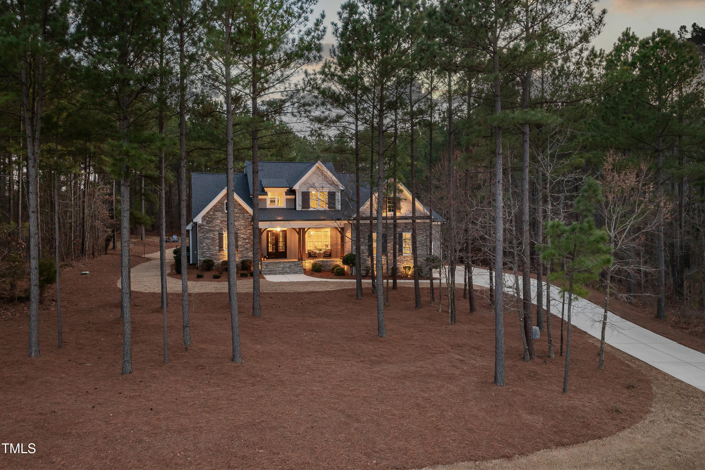 170 Pine Cone Loop Pittsboro, NC 27312 - Photo 8 of 58 a front view of a house with a porch