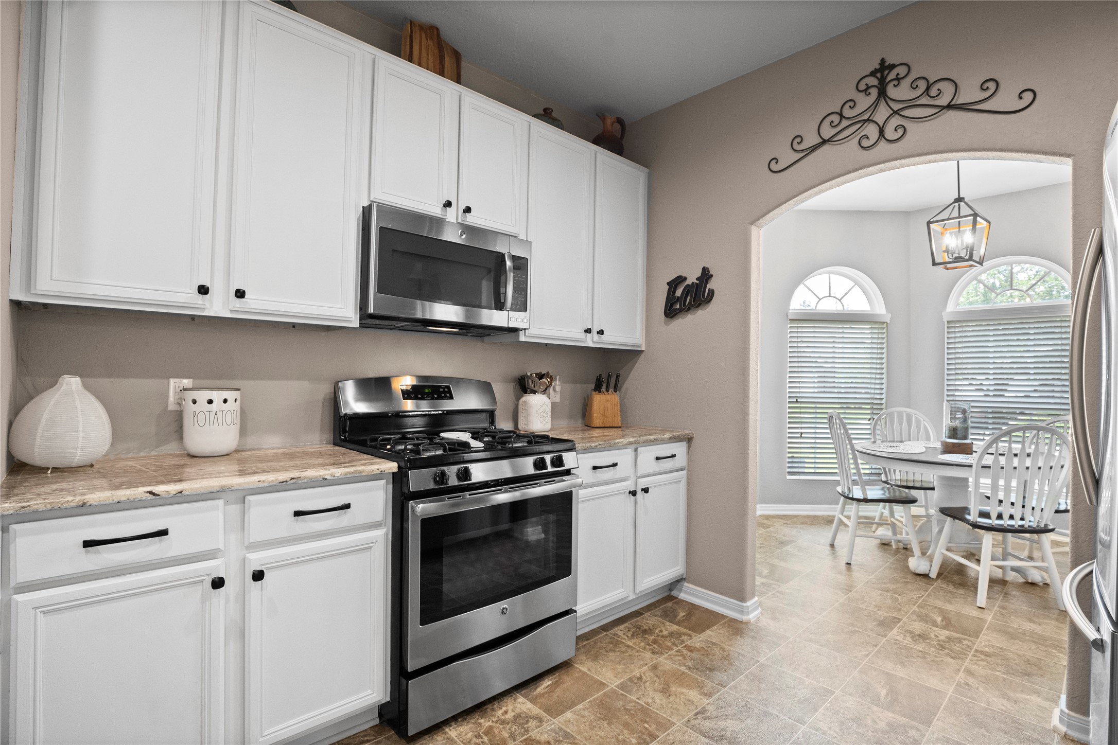 29307 Pear Side Court Spring, TX 77386 - Photo 5 of 29 Kitchen offers white cabinets, granite countertops and Stainless Steel Appliances