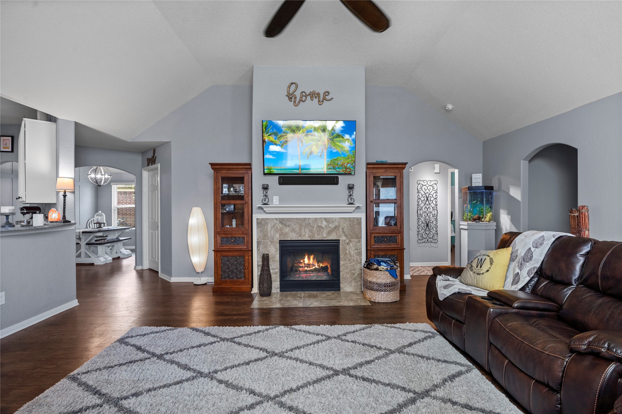 29307 Pear Side Court Spring, TX 77386 - Photo 10 of 29 Living room offers a cozy fireplace. Bookshelves on either side of the fireplace can be sold with the home.