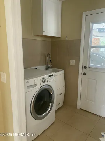 a utility room with dryer and washer