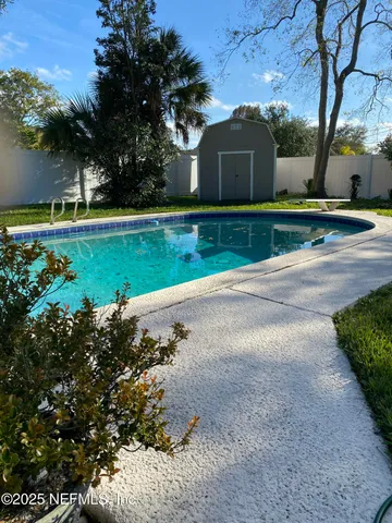 a view of a back yard of the house