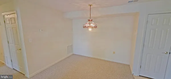 a view of a chandelier in big room