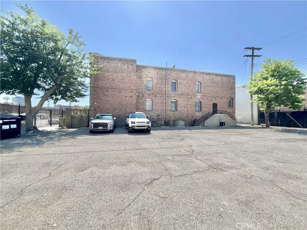 a view of street with parked cars