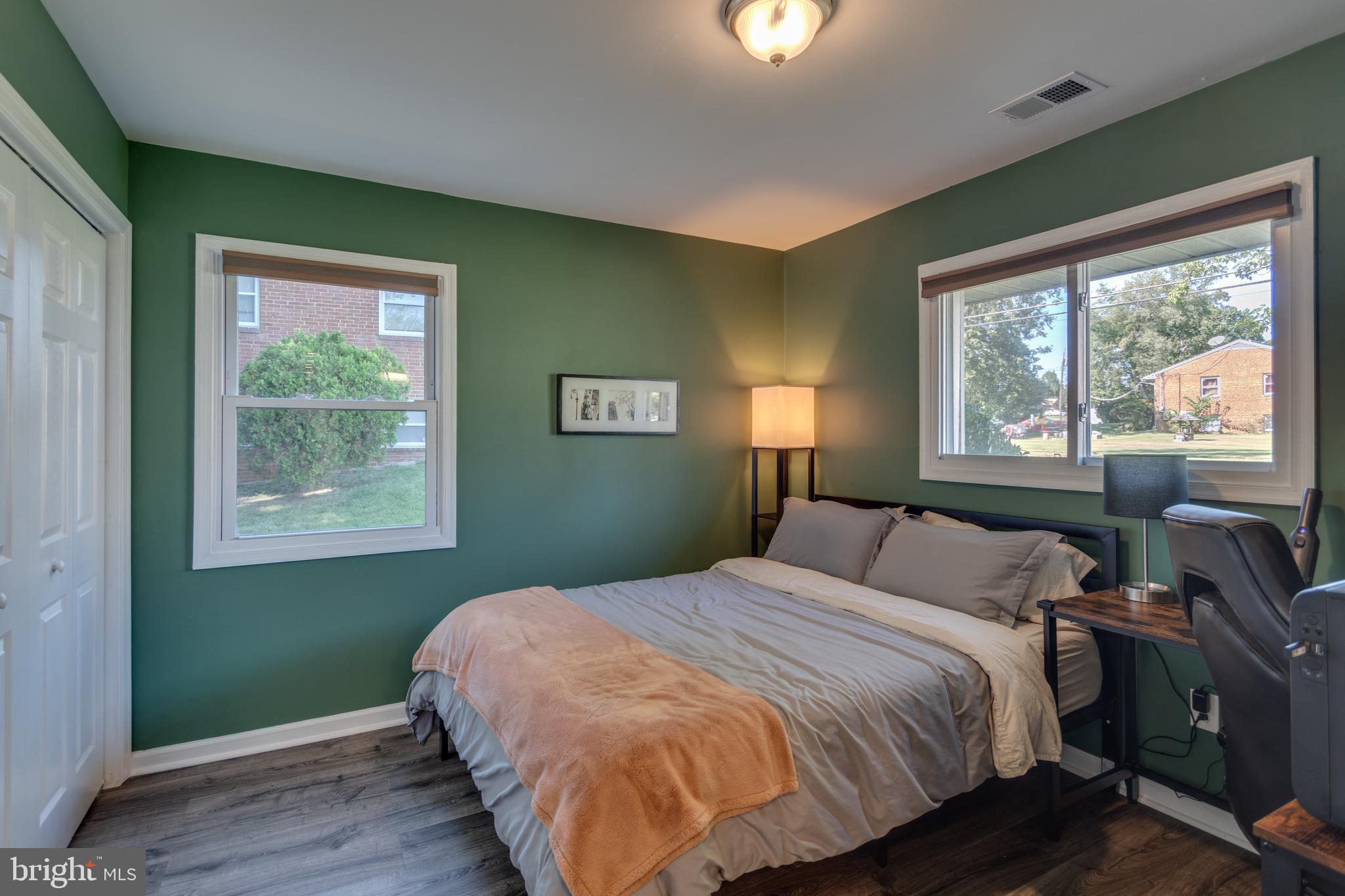 7431 Axton Street Springfield, VA 22151 - Photo 10 of 23 a bedroom with a bed and windows