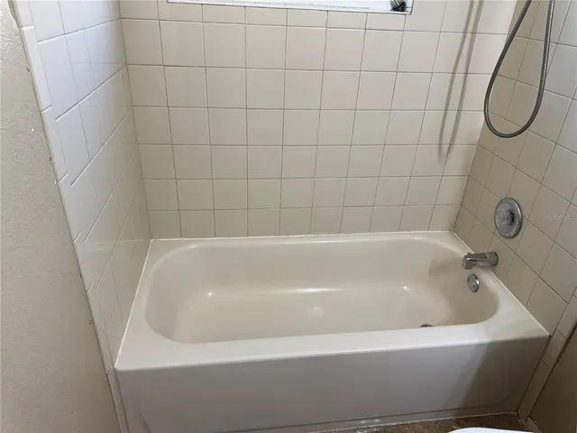 a bathroom with a bath tub