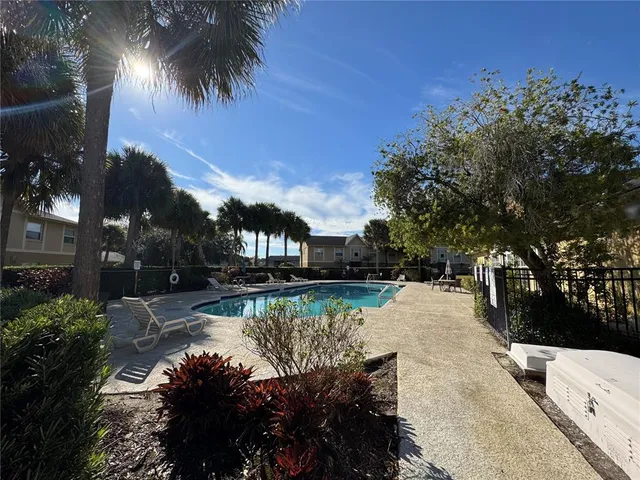 a view of a pathway with a yard