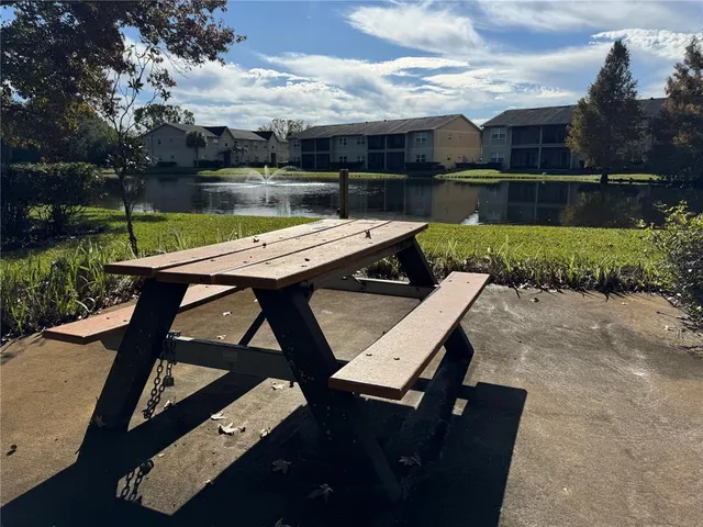 an outdoor sitting area with furniture