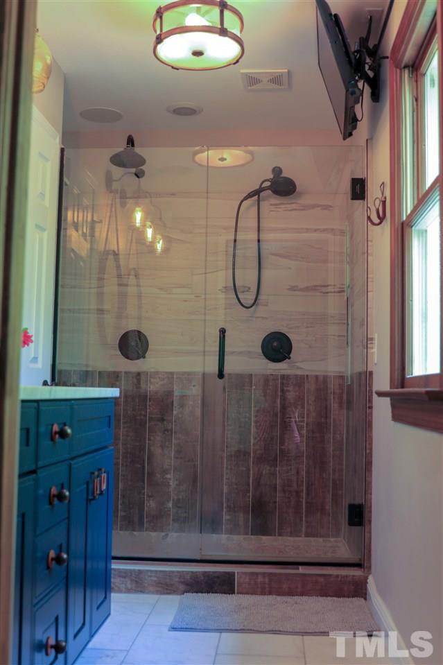 101 Springbrook Place Cary, NC 27518 - Photo 17 of 26 a bathroom with a shower