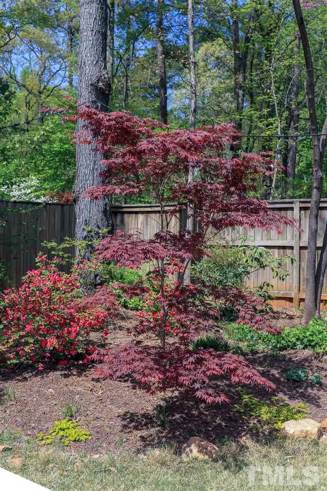 101 Springbrook Place Cary, NC 27518 - Photo 24 of 26 a view of a garden with flowers