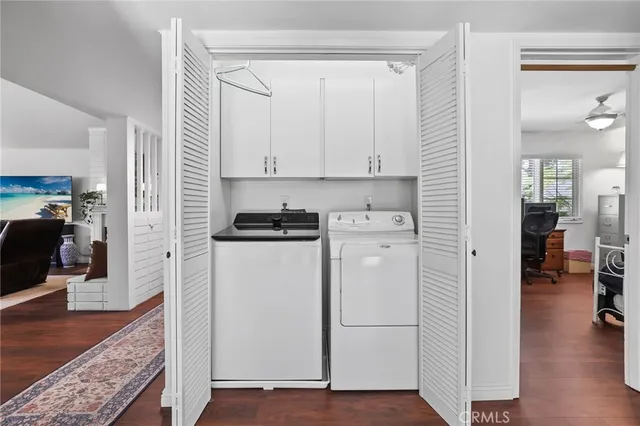 a view of kitchen with furniture and wooden floor