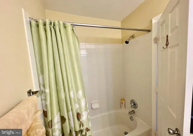 a bathroom with a shower and a tub