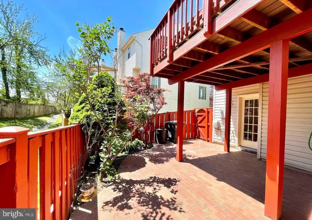 a view of a backyard with wooden fence