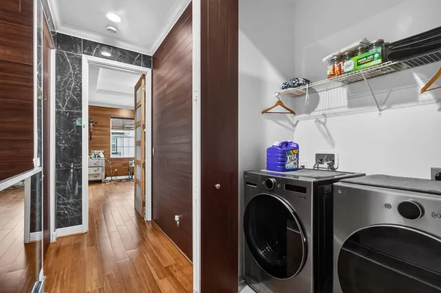 a bedroom with a bed and a wooden floor