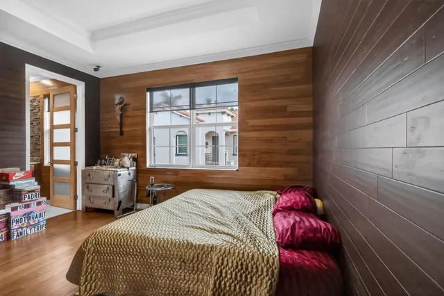 a bedroom with a bed and a table