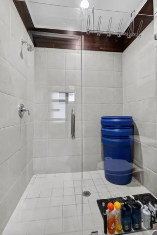 a bathroom with a granite countertop sink a toilet and a mirror