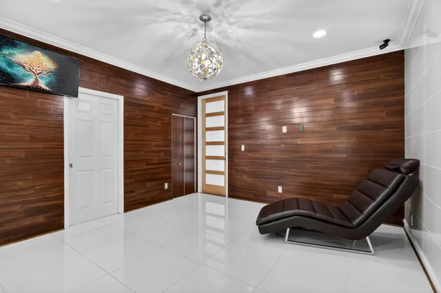 a kitchen with kitchen island granite countertop appliances cabinets a sink and a counter top space