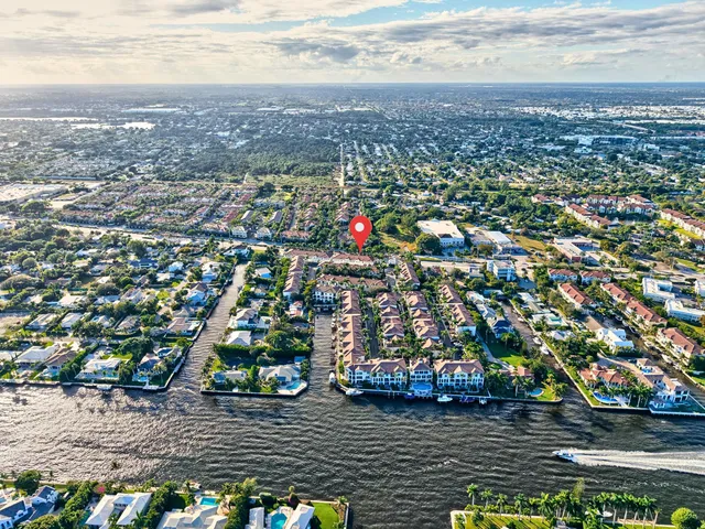 an aerial view of city and lake