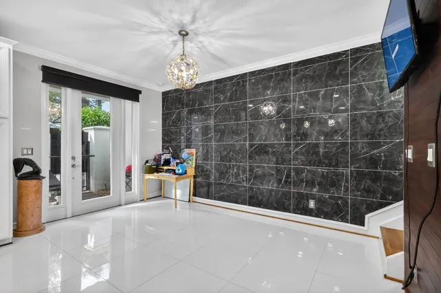 a view of a bathroom with a tub and a large window