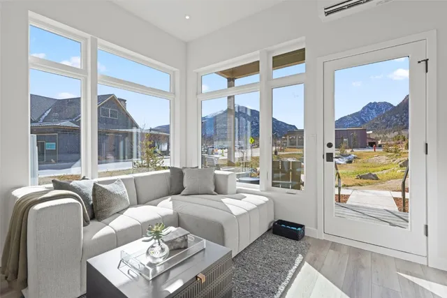 a living room with furniture and a large window