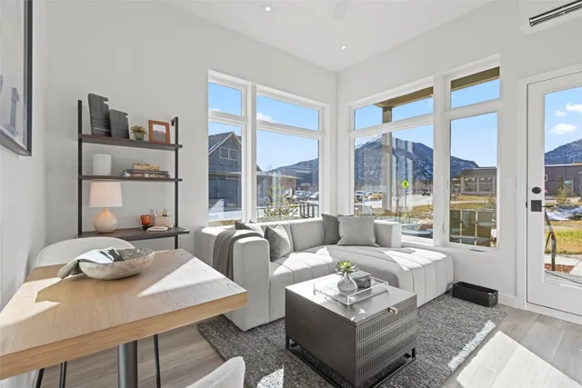 a living room with furniture and a large window