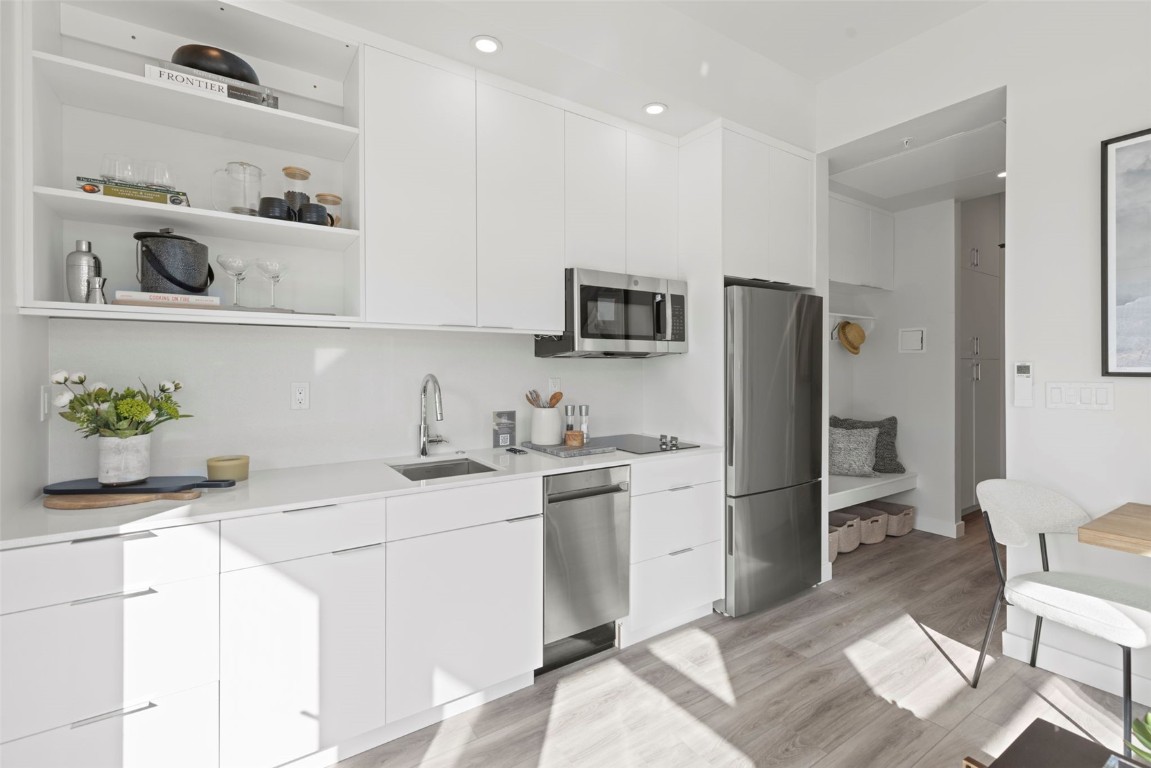 185 Lusher Court, Unit 109 Frisco, CO 80443 - Photo 6 of 21 a kitchen with a sink appliances and cabinets