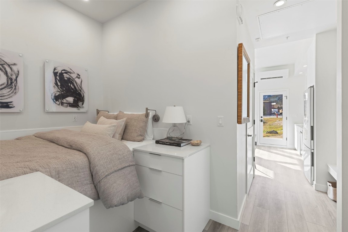 185 Lusher Court, Unit 109 Frisco, CO 80443 - Photo 7 of 21 a bedroom with a bed and a table