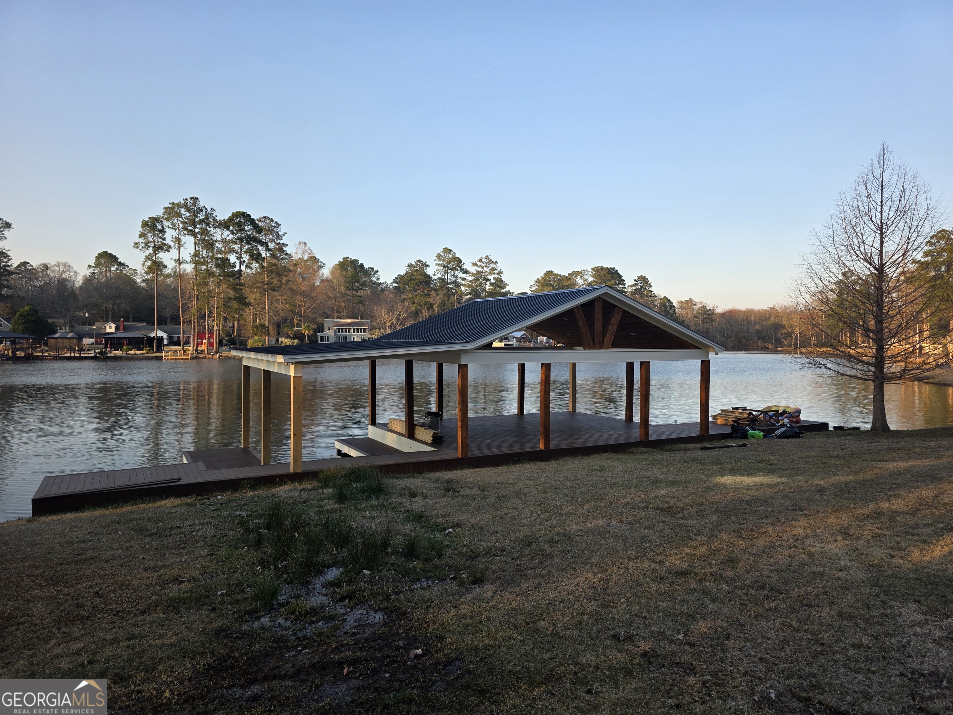 420 Rawley Road Americus, GA 31719 - Photo 12 of 15 a view of a house with a yard and a large tree