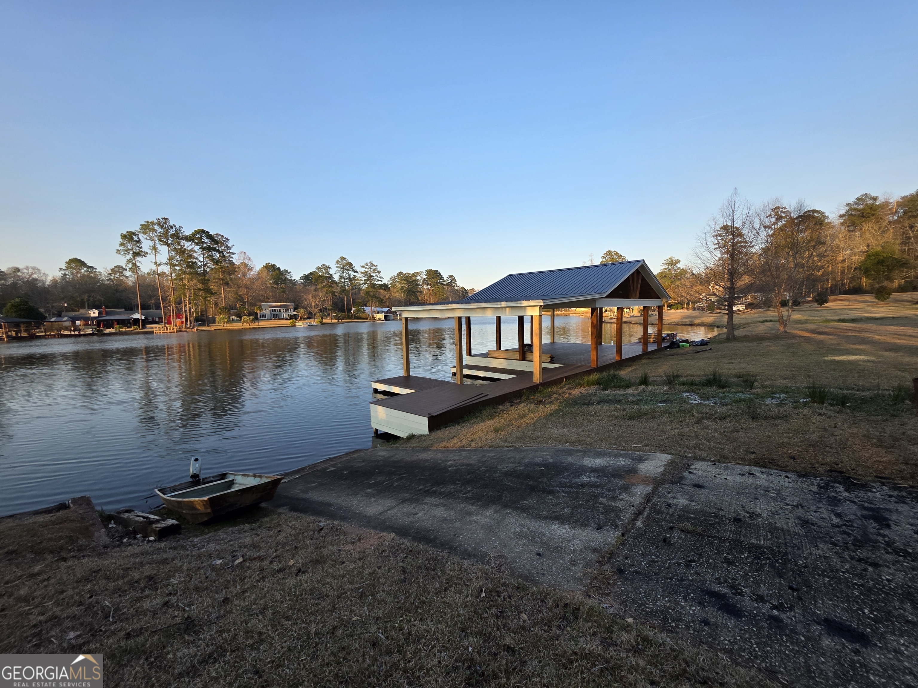 420 Rawley Road Americus, GA 31719 - Photo 13 of 15 a view of a house with a yard next to a lake view