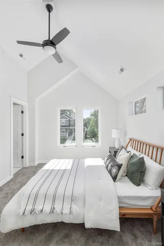 a bedroom with a bed and window