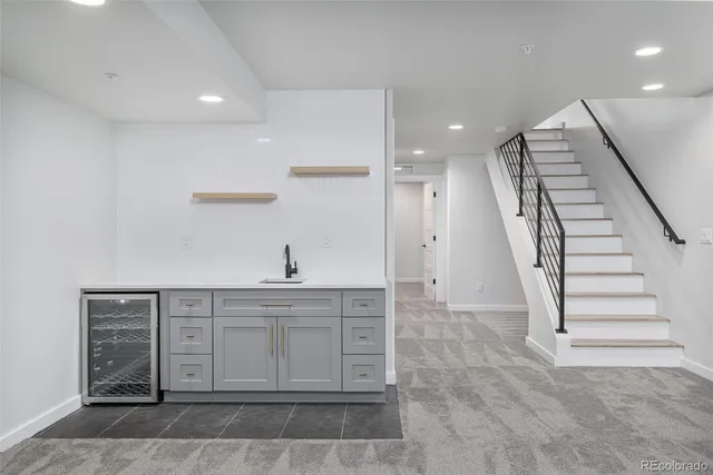 a view of a hallway with cabinet and mirrors