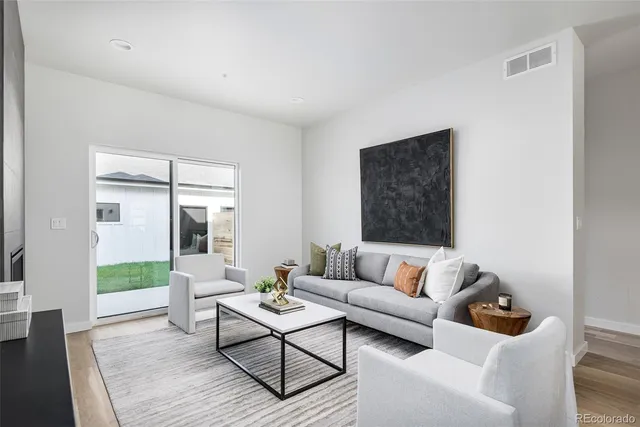 a living room with furniture and a table