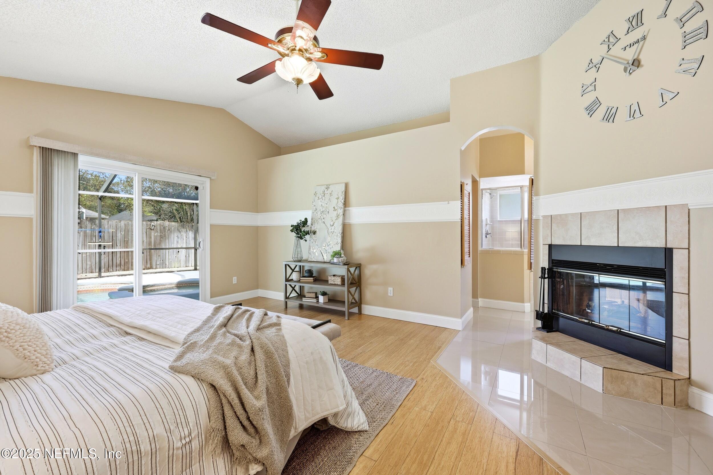 12351 Burgess Hill Circle South Jacksonville, FL 32246 - Photo 21 of 46 Fireplace opens to primary bath