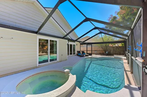 a house view with a sitting space and garden