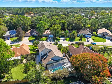 an aerial view of a house with a ocean view
