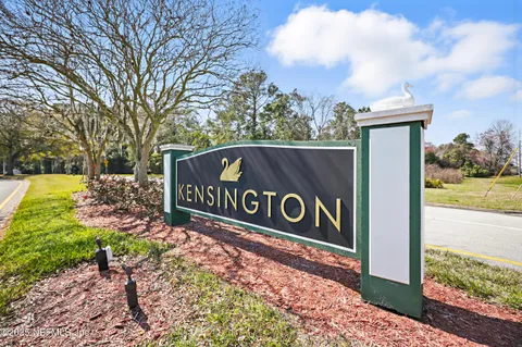 an aerial view of a house with a lake view